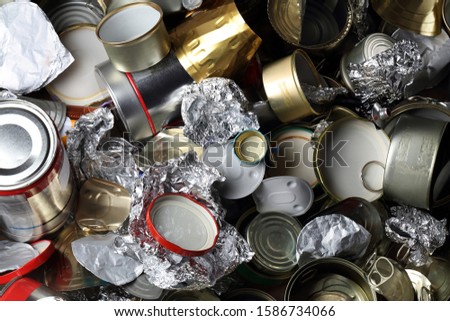 Various household metal waste - cans, lids, aluminum foil