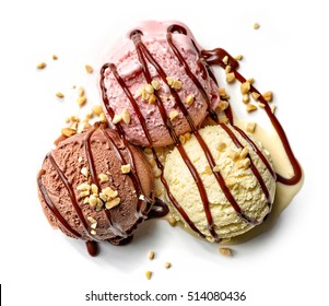 various ice cream balls with chocolate sauce and nuts isolated on white background, top view