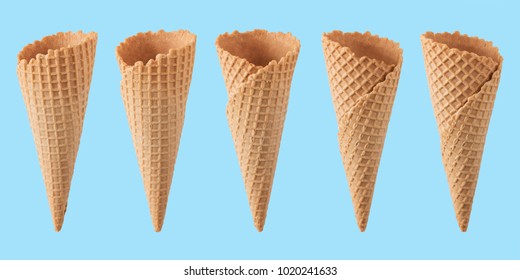 Various Ice Cream Cones Isolated On Blue Background.