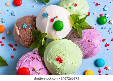 Various Ice Cream Scoops with sugar sprinkles and mint leaves close up. Organic frozen yogurt summer desert. - Powered by Shutterstock