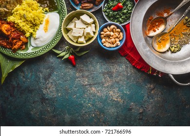 Various Indian Food Bowls With Curry, Yogurt ,rice,bread , Chicken,chutney, Paneer Cheese And Spices On Dark Rustic Background, Top View, Border