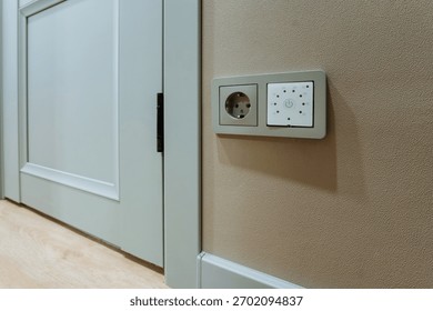 various interior electrical outlets equipped with safety mechanisms and multiple plugs, multiple safetyequipped electrical outlets installed inside building for enhanced user protection