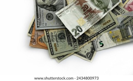  Various international currencies and US dollars on a light surface. Money isolated on white