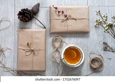 Various items for gift wrapping are on the table. Gifts already packed. Cone, wrapped books - Powered by Shutterstock