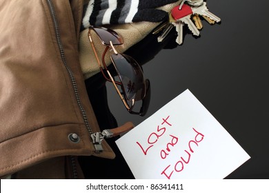 Various Items On A Lost And Found Table.