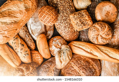 Various kind of bread with wheat top view. White bakery food concept panorama or wide banner photo. - Shutterstock ID 1548166310