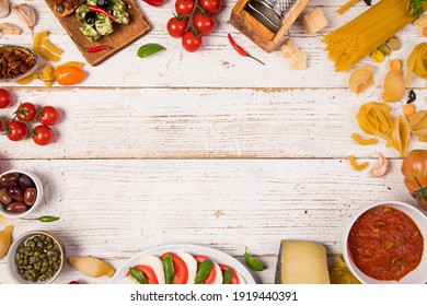Various Kind Of Italian Food Served On Vintage Wooden Table. Top View, Free Space For Text