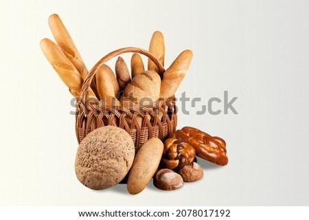 Various kinds of bread stuff. Bread rolls, baguette, sweet bun, croissant and bagel.