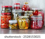 Various kinds preserves vegetables  in glass jars.