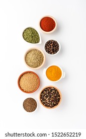 Various kinds of seasonings in bowls on white table. Top view - Shutterstock ID 1522652219
