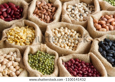 various of legumes in sack bag. organic food and creation of natural product concept.