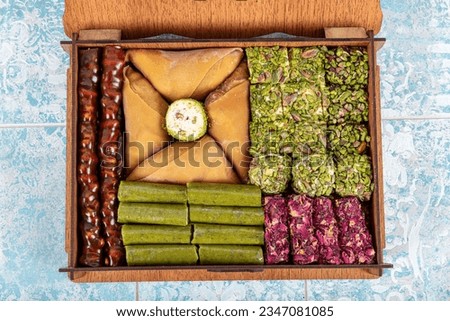 Various luxury turkish delights in gift box. Turkish Desserts, Ramadan sweets (Turkish delight and pistachio paste) decorated in gift boxes.