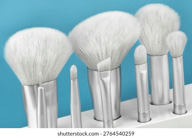 Various make up brushes  Set on blue background