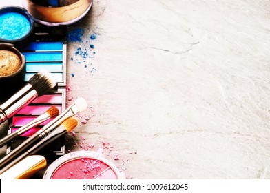 Various makeup products on dark background with copyspace. Beauty and fashion concept  - Powered by Shutterstock
