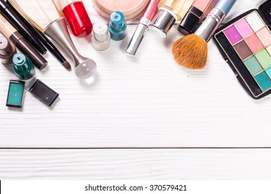 Various make-up products on wooden table with copy-space.Beauty and fashion concept