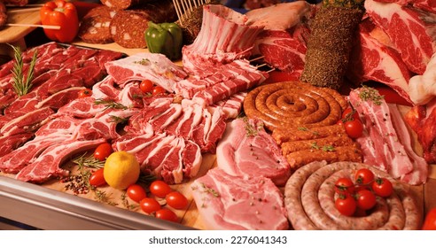 Various meat sausage rings and barbeque sticks on display. Meat products on display for sale in butchers table. - Powered by Shutterstock