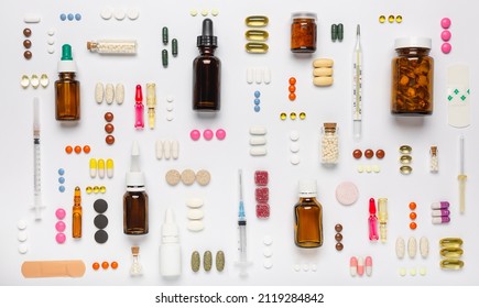 Various medical equipment, thermometer, ampoules, pipette, drugs, tablets, capsules, spray, patch, syringe, vials on a white background. Medicine, pharmacy, hospital, treatment, pharmacy concept. - Shutterstock ID 2119284842
