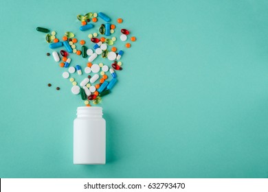 Various medications and vitamins, a pill bottle. Pastel background, place to insert your text. Health and pharmacy. - Shutterstock ID 632793470