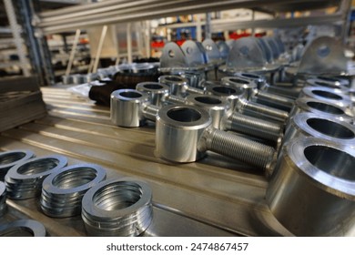 Various metal pieces are assembled on a table for mass production of automotive tire parts at an engineering event in a building equipped with machines and gas supply - Powered by Shutterstock