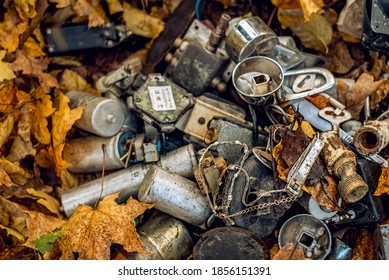 various metal things thrown in the forest