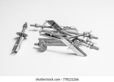 Various Metal Toggle Bolt On A White Background