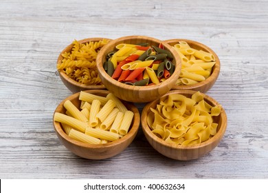 Various mix of pasta on wooden rustic background, sack. Diet and food concept. diversity - Powered by Shutterstock