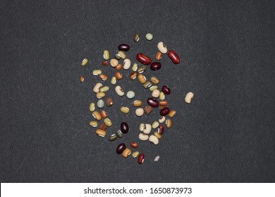 Various multicolred beans isolated on black background