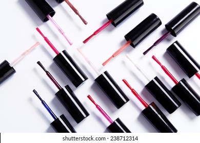 Various nail polish brushes isolated on white background