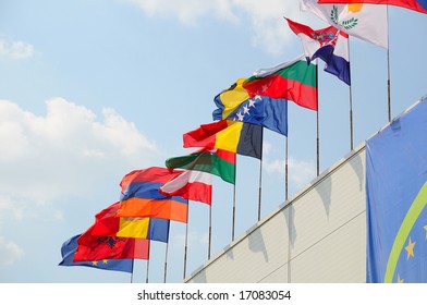 various national flags flapping in the wind