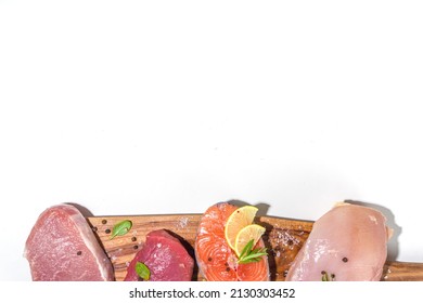 Various Natural Food, High Animal Protein Sources - Pork, Beef Meat Steaks, Chicken Breast Fillet, Eggs, Salmon Fish On White Table Background Top View Copy Space 