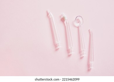 Various Nozzles For Cleaning Teeth With Water Jet Pink Background Dental Water Teeth Cleaner Water Flossing Oral Irrigator