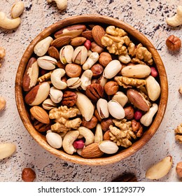 Various Nuts In Wooden Bowl, Top View.