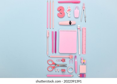 Various office supplies in pink color on a blue background . Back to school. - Powered by Shutterstock