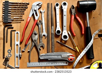 Various old tools lined up on the desk.