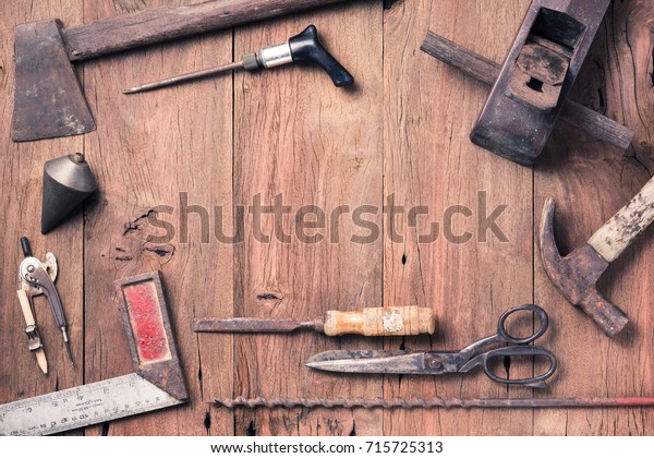 various of old\
tools on space of old wood\
plank