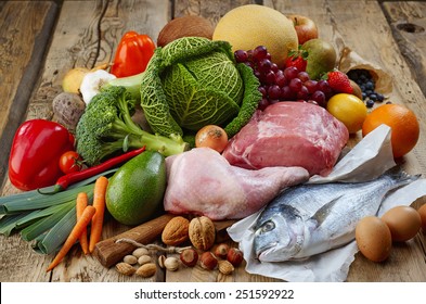 Various Paleo diet products on wooden table - Shutterstock ID 251592922