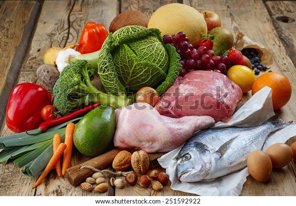 Various Paleo diet\
products on wooden\
table