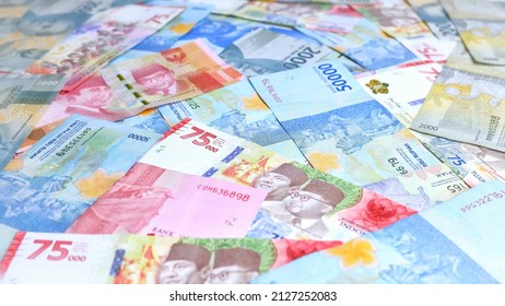 Various paper money of Indonesian Rupiah. Concept of finance, investment, economy, business and success. Rupiah banknote. - Shutterstock ID 2127252083