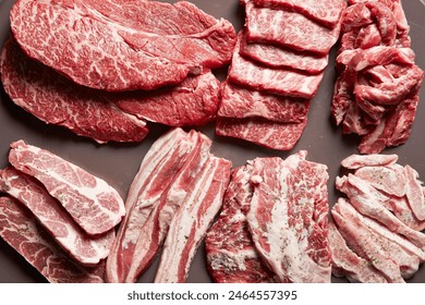 Various parts of raw beef and raw pork - Powered by Shutterstock