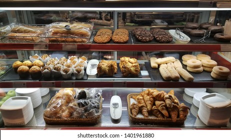 Various Pastries In A Display Case