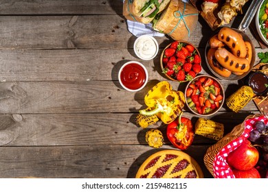 Various Picnic Barbeque Food And Drink Flatlay. Summer Bbq Picnic Food, Assorted Grilled Meats, Kebabs, Vegetable, Fruit Salad, Traditional Picnic Summer Pie Cake, Sandwiches, Top View Copy Space