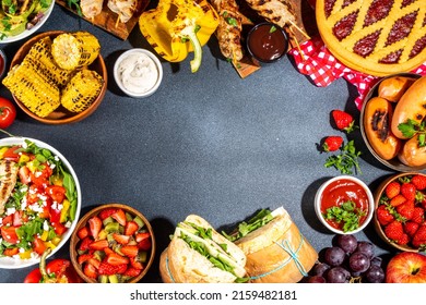 Various Picnic Barbeque Food And Drink Flatlay. Summer Bbq Picnic Food, Assorted Grilled Meats, Kebabs, Vegetable, Fruit Salad, Traditional Picnic Summer Pie Cake, Sandwiches, Top View Copy Space