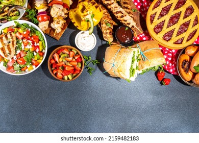 Various Picnic Barbeque Food And Drink Flatlay. Summer Bbq Picnic Food, Assorted Grilled Meats, Kebabs, Vegetable, Fruit Salad, Traditional Picnic Summer Pie Cake, Sandwiches, Top View Copy Space