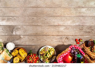 Various Picnic Barbeque Food And Drink Flatlay. Summer Bbq Picnic Food, Assorted Grilled Meats, Kebabs, Vegetable, Fruit Salad, Traditional Picnic Summer Pie Cake, Sandwiches, Top View Copy Space