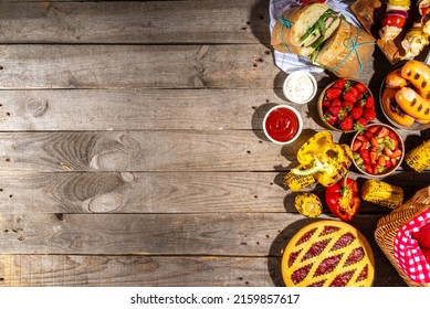 Various Picnic Barbeque Food And Drink Flatlay. Summer Bbq Picnic Food, Assorted Grilled Meats, Kebabs, Vegetable, Fruit Salad, Traditional Picnic Summer Pie Cake, Sandwiches, Top View Copy Space