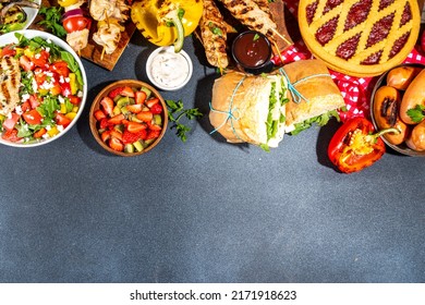 Various Picnic Barbeque Food And Drink Flatlay. Summer Bbq Picnic Food, Assorted Grilled Meats, Kebabs, Vegetable, Fruit Salad, Traditional Picnic Summer Pie Cake, Sandwiches, Top View Copy Space