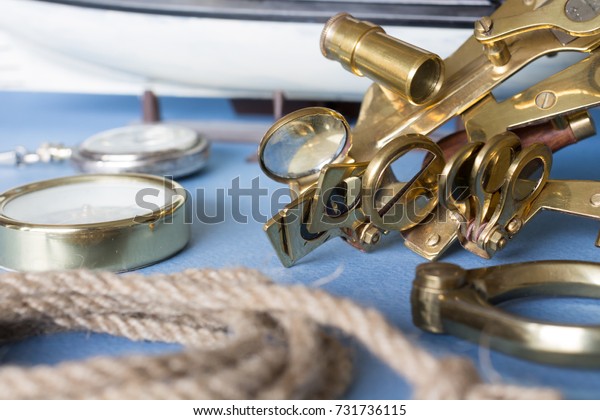 Various\
pieces of nautical equipment on blue\
background