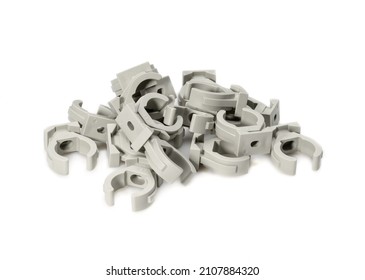 Various plastic fittings for polypropylene pipes on a white background
