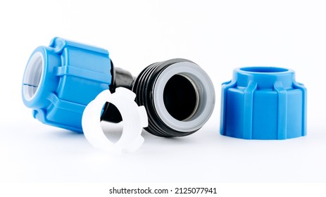 Various plastic fittings for polypropylene pipes on white insulated background