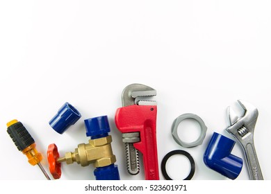 Various Plumbing Tools And Materials On White Background